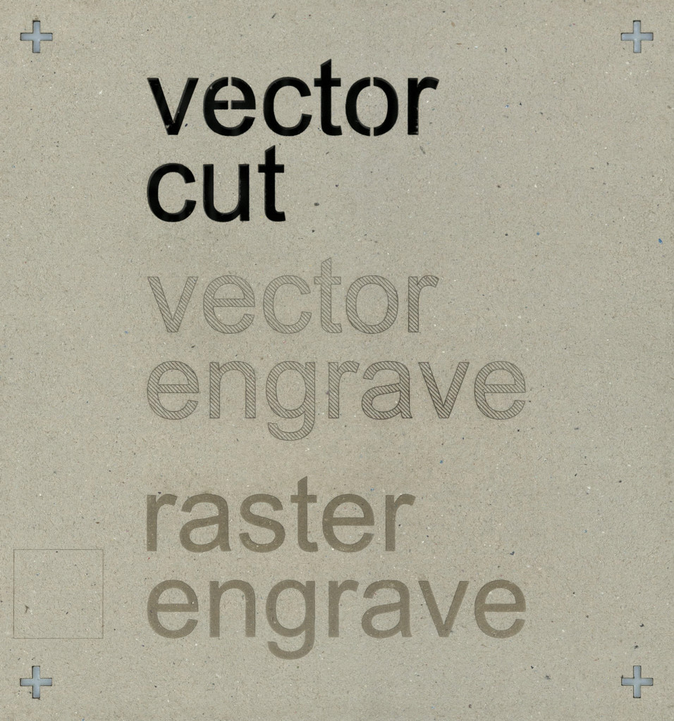 Photo of laser-engraved and cut chipboard, displaying vector and raster operations.