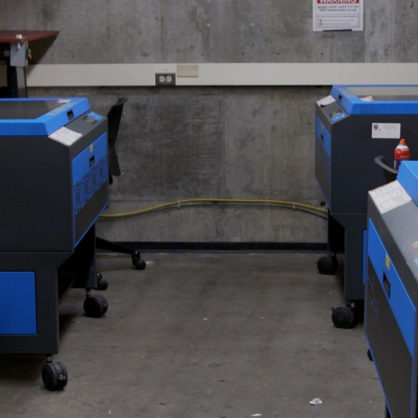Photo of room L40D, showing 4 of the laser cutters at the GSD.