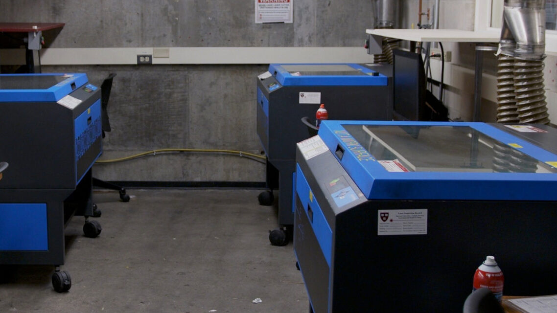 Photo of room L40D, showing 3 of the laser cutters at the GSD.